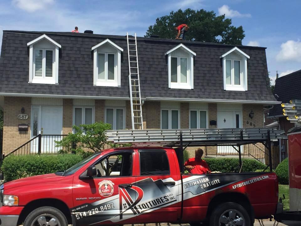 ap roofing in front of house